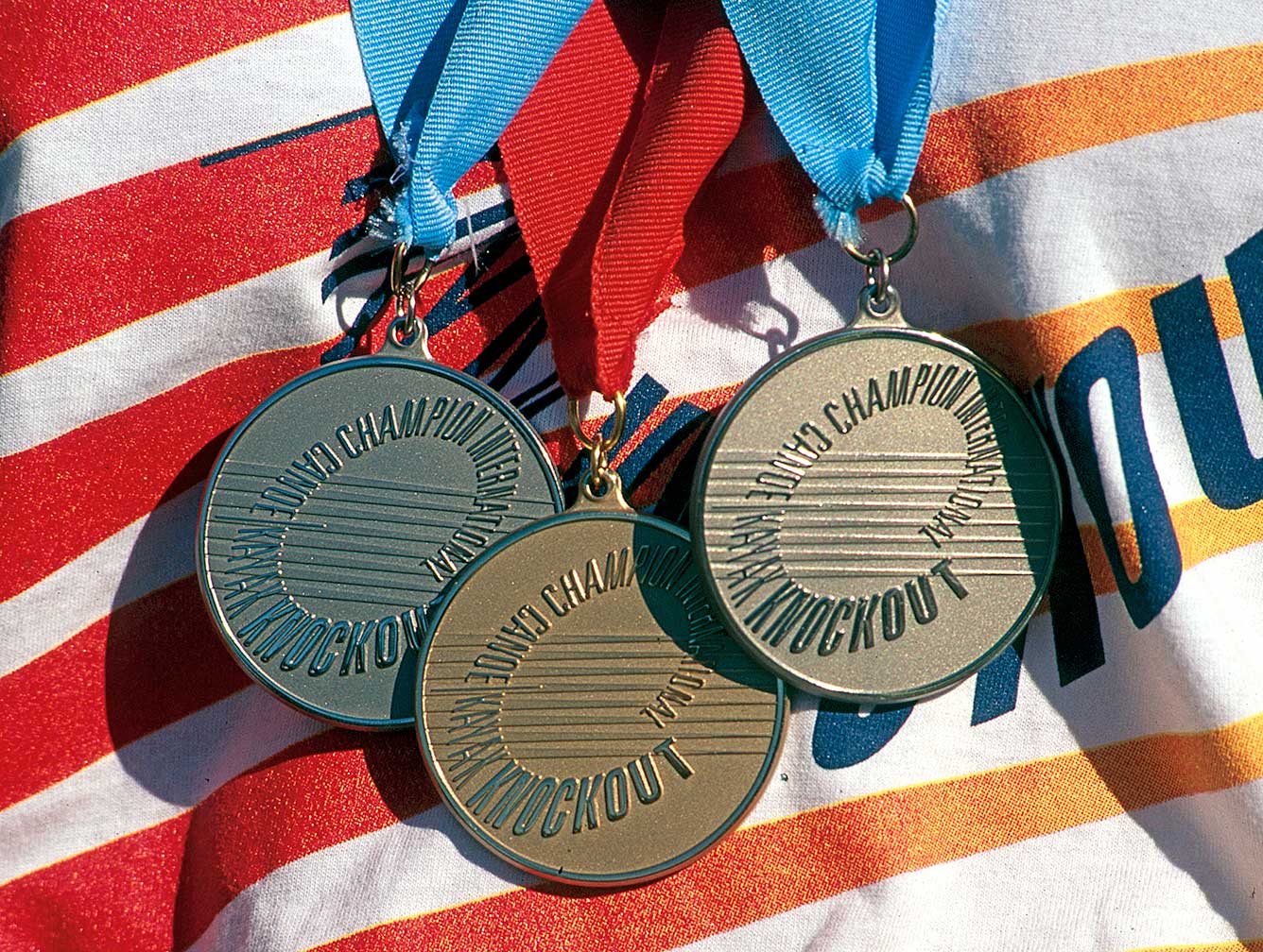 champion-intl-canoe-knockout_medals.jpg Art Direction by: Bart Crosby, Crosby Associates